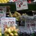 (FILES) In this file photo taken on May 12, 2022 The price of fruit and vegetables in pounds sterling is displayed on a trader’s market stall in London. – British annual inflation unexpectedly accelerated in February despite central bank efforts to tame a growing cost-of-living crisis, official data showed on March 22, 2023. “Food and non-alcoholic drink prices rose to their highest rate in over 45 years with particular increases for some salad and vegetable items as high energy costs and bad weather across parts of Europe led to shortages and rationing.” (Photo by JUSTIN TALLIS / AFP)