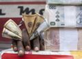 DR Congo currency drops amid war spending, arrears payments