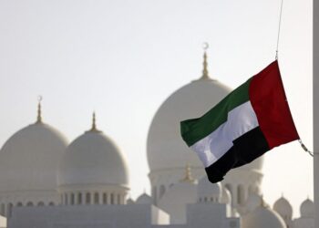 The flag of United Arab Emirates flies at half-mast outside the Sheikh Zayed Grand Mosque in Abu Dhabi on May 13, 2022, following the death of UAE’s President Sheikh Khalifa bin Zayed Al-Nahyan. – UAE’s President Sheikh Khalifa bin Zayed Al-Nahyan died aged 73 after a years-long battle with illness, triggering a period of mourning and a handover of power in the oil-rich Gulf state. (Photo by Karim SAHIB / AFP)