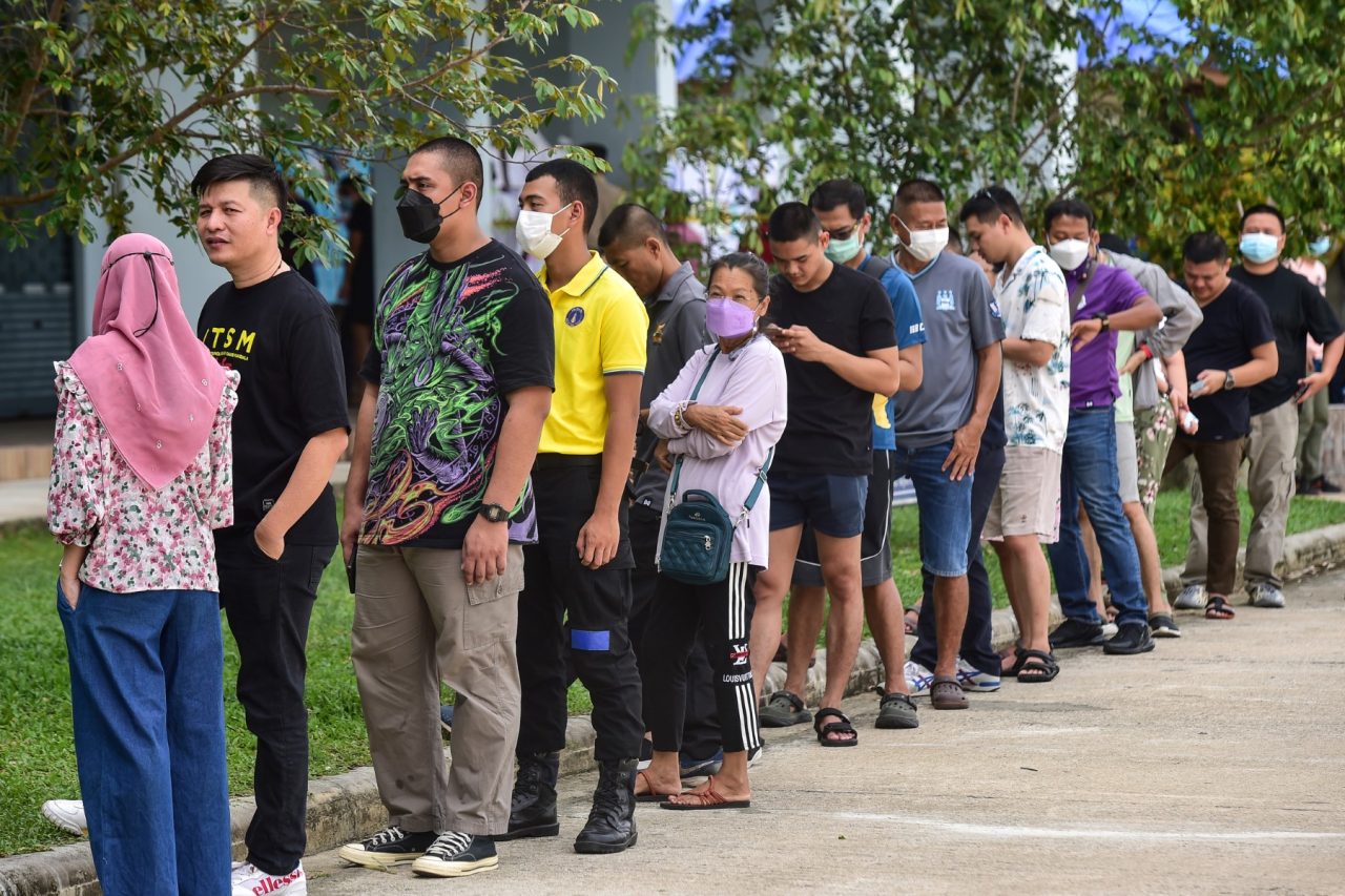 Thais queue at temples, schools as early voting begins