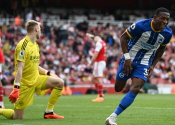 Brighton’s Ecuadrorian defender Pervis Estupinan celebrates after scoring his team third goal during the English Premier League football match between Arsenal and Brighton and Hove Albion at the Emirates Stadium in London on May 14, 2023. (Photo by Glyn KIRK / AFP)