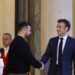 Ukraine’s President Volodymyr Zelensky (C,L) is welcomed by France’s President Emmanuel Macron (C,R) upon his arrival at the Elysee presidential palace in Paris on May 14, 2023. – Ukraine’s President Volodymyr Zelensky landed in Paris for talks with French President Emmanuel Macron, after accepting a prize for his country’s fight for “European ideals” during a visit to Germany. (Photo by Ludovic MARIN / AFP)