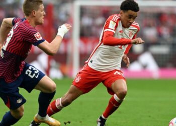 Bayern Munich’s midfielder Jamal Musiala (R) and Leipzig’s defender Marcel Halstenberg vie for the ball during the German first division Bundesliga football match between FC Bayern Munich and RB Leipzig in Munich, southern Germany, on May 20, 2023. (Photo by Christof STACHE / AFP)