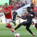 Nottingham Forest’s French defender Moussa Niakhate (R) vies with Arsenal’s English midfielder Bukayo Saka during the English Premier League football match between Nottingham Forest and Arsenal at The City Ground in Nottingham, central England, on May 20, 2023. (Photo by Darren Staples / AFP)