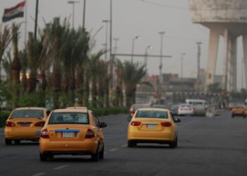 In this photo taken on May 18. 2023, vehicles drive in central Baghdad. – Oil-dependent Iraq has been warned its economy risks going into “intensive care” unless it diversifies in line with worldwide efforts to tackle the impact of fossil fuels on global warming. The country’s vast oil reserves are enough to see it produce crude at current rates for another century, but as the world works to wean itself off hydrocarbons, Baghdad has been slow to adapt. (Photo by AHMAD AL-RUBAYE / AFP)