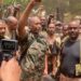 This picture released on the Sudanese Army’s Facebook page on May 30, 2023, shows army chief Abdel Fattah al-Burhan cheering with soldiers as he visits some of their positions in Khartoum. – Fighting flared again in Sudan on May 30 despite the latest ceasefire pledges of warring generals meant to allow desperately needed aid to reach besieged civilians. Both the army and the paramilitary Rapid Support Forces formally agreed a day earlier to extend by five days a US and Saudi-brokered humanitarian truce that was frequently violated over the past week. (Photo by – / SUDAN’S ARMED FORCES FACEBOOK PAGE / AFP) / /