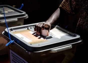 (FILES) A man casts his ballot in a polling station located in the suburb of Mbare in Zimbabwe’s capital Harare, on July 30, 2018. – Zimbabwe will hold nationwide elections on August 23, 2023 according to an announcement in the official government gazette on May 31, 2023 that ended months-long suspense. (Photo by Luis TATO / AFP)