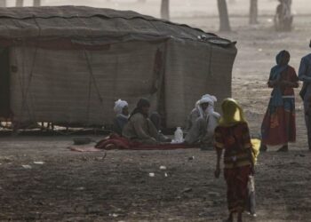 A family belonging to an Arab nomadic tribe sit outside their tent in Walia Tradex, in the outskirts of N’djamena,- One of the plagues that has afflicted Chad, like other countries in the region, is the conflict between the nomadic Arab and Muslim herders from the north, the arid Sahel strip, and farmers from the N’Djamena region and from the South, who are mainly Christians or animists, who live in the “useful Chad” of the French colonial era. (Photo by MARCO LONGARI / AFP) (Photo by MARCO LONGARI/AFP via Getty Images)