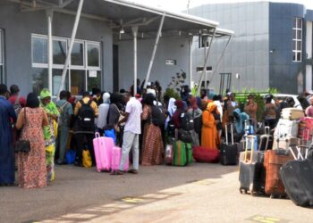 Pic. 21. Fourth batch of 834 Nigerians stranded in Sudan arrived at the Nnamdi Azikiwe International Airport, in Abuja on Sunday (7/5/23) 01529/7/5/2023/Hogan Bassey/NAN