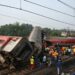 Rescue workers gather around damaged carriages during search for survivors at the accident site of a three-train collision near Balasore, about 200 km (125 miles) from the state capital Bhubaneswar in the eastern state of Odisha, on June 3, 2023. – At least 288 people were killed and more than 850 injured in a horrific three-train collision in India, officials said on June 3, the country’s deadliest rail accident in more than 20 years. (Photo by DIBYANGSHU SARKAR / AFP)