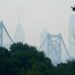 Smoke from Canada’s wildfires casts a haze over the Philadelphia skyline, as seen from Camden, New Jersey on June 7, 2023. An orange-tinged smog caused by Canada’s wildfires shrouded New York on June 7, 2023, obscuring skyscrapers and causing residents to don face masks, as cities along the US East Coast issued air quality alerts. (Photo by Joe LAMBERTI / AFP)