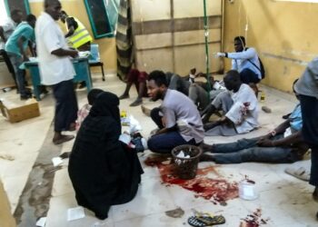 In this picture taken on June 20, 2023, wounded people receive treatment at the al-Bashayer hospital in northern Khartoum. (Photo by – / AFP)