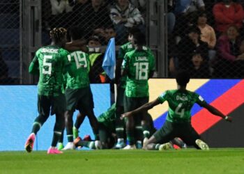 Nigeria's forward Ibrahim Muhammad (C-covered) celebrates with teammates after scoring a goal during the Argentina 2023 U-20 World Cup round of 16 football match between Argentina and Nigeria at the San Juan del Bicentenario stadium in San Juan, Argentina, on May 31, 2023. (Photo by Andres Larrovere / AFP) (Photo by ANDRES LARROVERE/AFP via Getty Images)