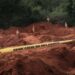 Digged holes are seen after exhuming bodies at the mass-grave site in Shakahola, outside the coastal town of Malindi, on April 25, 2023. (Photo by YASUYOSHI CHIBA/AFP)