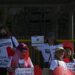 In this photo taken on February 14, 2023 shows pro-divorce protesters taking part in a demonstration on Valentine's Day in front of the Senate Building in Pasay, Metro Manila. - The Philippines is the only place outside the Vatican where divorce is outlawed, with the Catholic Church -- which holds great influence on Philippine society -- opposing the practice as against its teachings. (Photo by JAM STA ROSA / AFP) / TO GO WITH "PHILIPPINES-DIVORCE-RELIGION-POLITICS", FOCUS BY ARA EUGENIO - To go with "Philippines-divorce-religion-politics", FOCUS by Ara Eugenio