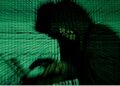 A man holds a laptop computer as cyber code is projected on him in this illustration picture taken on May 13, 2017. REUTERS/Kacper Pempel/Illustration/File Photo