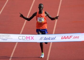 FILES) Kenya’s Titus Ekiru crosses the finishing line to win The Mexico City International Marathon, at the Olimpic Universitary Stadium in Mexico City on August 26, 2018. – Kenya’s Titus Ekiru, sixth fastest man in history in the marathon, is facing a potential 10-year ban after receiving a provisional suspension for doping, the Athletics Integrity Unit (AIU) said July 3, 2023, Ekiru has two marathon wins to his name including victory in Milan in May 2021 in the exceptionally fast time of 2hr 2min 57sec. (Photo by PEDRO PARDO / AFP)