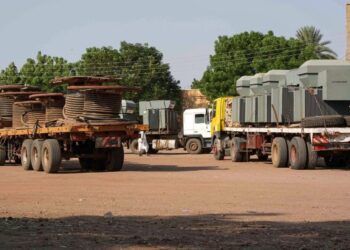 Freight trucks are parked in Hasahisa city in al-Jazirah state on July 22, 2023, as road transport is drastically reduced in war-torn Sudan. – With air strikes, artillery blasts and countless checkpoints around Khartoum, road traffic across the country has dropped by 90 percent since fighting began on April 15, according to a report by Sudan’s national chamber of transport. (Photo by – / AFP)