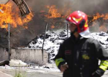 Italian Firefighters work to extinguish a fire which broke out in a garbage dump near Ciampino Airport in Rome, Saturday, July 29, 2023. (AP Photo/Gregorio Borgia)