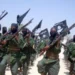 FILE - Al-Shabab fighters march with their weapons during military exercises on the outskirts of Mogadishu, Somalia, Feb. 17, 2011. The U.S. military said, July 9, 2023, it has conducted three new airstrikes against al-Shabab fighters in the Lower Juba region.