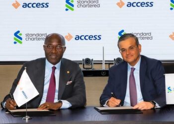 Group Managing Director, Access Bank Plc, Roosevelt Ogbonna (left); Regional Chief Executive Officer, Africa and Middle East, Standard Chartered, Sunil Kaushal, signing agreements for the sale of Standard Chartered’s shareholding in its subsidiaries in Angola, Cameroon, The Gambia, and Sierra Leone, and its Consumer, Private & Business Banking business in Tanzania,recently.