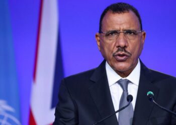 (FILES) Niger’s President Mohamed Bazoum presents his national statement as part of the World Leaders’ Summit of the COP26 UN Climate Change Conference in Glasgow, Scotland on November 1, 2021. – Niger President Mohamed Bazoum is being detained by members of the Presidential Guard, who have been given an “ultimatum” by the army, a source close to Bazoum said on July 23, 2023.Disgruntled members of the guard sealed off access to the president’s residence and offices, and after talks broke down “refused to release the president,” the source said, adding: “The army has given them an ultimatum.” (Photo by YVES HERMAN / POOL / AFP)