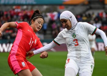 South Korea's forward Choe Yu-Ri, left, and Morocco's defender Nouhaila Benzina fight for the ball