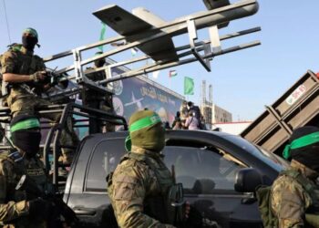 Fighters of the Hamas military wing Ezzedin al-Qassam Brigades display military hardware during a parade in the Gaza city of Rafah a week after Hamas and Israel agreed a ceasefire ending a deadly and devastating 11-day confrontation – AFP