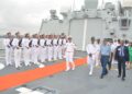 Chinese and Nigerian naval personnel walk aboard a Chinese ship in Lagos.