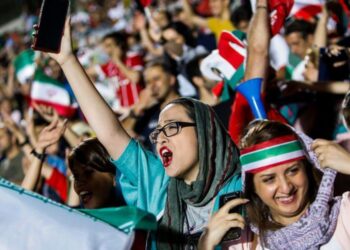 Women cheering at a screening of a match at last year’s World Cup – one of the very rare occasions female fans were admitted alongside men