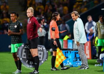 [FILE PHOTO] Nigeria’s coach Randy Waldrum (R) speaks with German assistant referee Katrin Rafalski (2nd R) during the Australia and New Zealand 2023 Women’s World Cup Group B football match between Australia and Nigeria at Brisbane Stadium in Brisbane on July 27, 2023. (Photo by Patrick Hamilton / AFP)