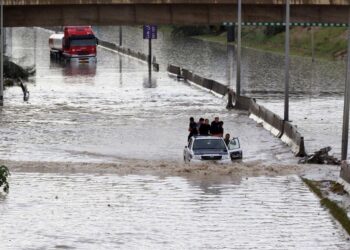 AFP file photo: Traffic in a flooded Tripoli street in 2019.