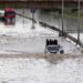 AFP file photo: Traffic in a flooded Tripoli street in 2019.