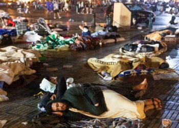 Residents take shelter ouside at a square following an earthquake in Marrakesh on September 9, 2023. Nearly 300 people were killed after a powerful earthquake rattled Morocco on September 8 night, according to a preliminary government count, with Marrakesh residents reporting “unbearable” screams followed the 6.8-magnitude quake. (Photo by Fadel SENNA / AFP)