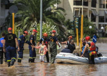 People are rescued by volunteers and firefighters from the flooded city of Larissa, central Greece, on September 9, 2023. – Firefighters backed by the army were rescuing hundreds of people on September 9, 2023 in villages in central Greece blocked off by floods that have claimed at least 10 lives. (Photo by STRINGER / AFP)