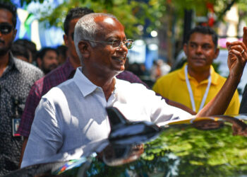 Ibrahim Mohamed Solih (C), the incumbent Maldives President shows his ink marked finger after casting his ballot during presidential election in Male on September 9, 2023. – Polling began September 9 in the Maldives’ presidential vote, officials said, with incumbent Ibrahim Mohamed Solih facing a tough re-election bid. Solih is seeking a second term in a poll that has turned into a referendum on his pursuit of renewed ties with India, the archipelago nation’s traditional benefactor. (Photo by Mohamed Afrah / AFP)