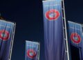 Flags with UEFA logo are seen outside of the Union of European Football Associations headquarters in Nyon, Switzerland, October 5, 2022. REUTERS/Denis Balibouse/File Photo