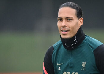 Liverpool’s Dutch defender Virgil van Dijk looks on during a training session at the Liverpool FC training ground in Liverpool, north west England, on April 12, 2022, on the eve of their UEFA Champions League quarter final 2nd leg football match against Benfica. (Photo by Paul ELLIS / AFP)