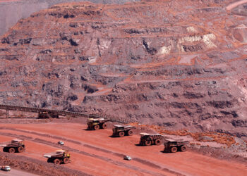 FILE PHOTO: Haul trucks are seen at Kumba Iron Ore, the world's largest iron ore mines in Khathu, Northern Cape Province November 15, 2011. REUTERS/Siphiwe Sibeko/File Photo