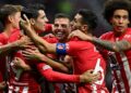 Atletico Madrid’s Spanish forward #19 Alvaro Morata celebrates with teammates after scoring his team’s third goal during the UEFA Champions League 1st round day 2 group E football match between Club Atletico de Madrid and Feyenoord at the Wanda Metropolitano stadium in Madrid on October 4, 2023. (Photo by JAVIER SORIANO / AFP)