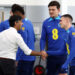 Britain’s Prime Minister Rishi Sunak (L) shakes hands with England’s midfielder Phil Foden (R) as he meets England’s striker Marcus Rashford (3L), England’s midfielder Declan Rice (2L), England’s defender Harry Maguire (2R) and England’s midfielder Phil Foden during an England training session at St George’s Park in Burton-on-Trent, central England, on October 10, 2023. – Seven years after awarding Euro-2024 to Germany, UEFA announced on October 10, 2023 the hosts for the next two editions: The United Kingdom and Ireland are due to host the tournament together in 2028, followed by the unprecedented tandem of Italy and Turkey in 2032. (Photo by Darren Staples / POOL / AFP)