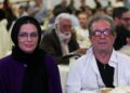 (FILES) Iranian film director Dariush Mehrjui and his wife Vahida Mohammadifar attend a ceremony in Tehran on July 1, 2015. – One of Iran’s most important film-makers, Mehrjui, was stabbed to death on October 14 alongside his wife at their home near the Iranian capital. The 83-year-old was indelibly associated with the Iranian new wave of cinema, having made “The Cow” in 1969, one of the movement’s first films. (Photo by Abdulwahed MIRZAZADEH / isna news / AFP)