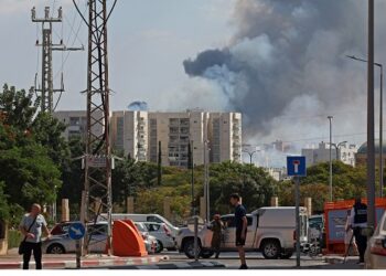 Smoke billows in Ashkelon on October 7, 2023, as barrages of rockets were fired from the Palestinian enclave into Israeli territory. (Photo by AHMAD GHARABLI / AFP)