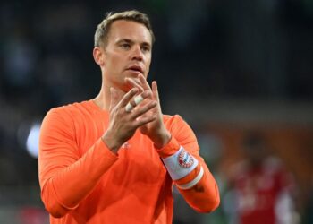 Bayern Munich’s German goalkeeper Manuel Neuer acknowledges the fans after the German first division Bundesliga football match between Borussia Moenchengladbach and FC Bayern Munich in Moenchengladbach, western Germany, on August 13, 2021. – The match ended in a 1-1 draw. (Photo by Ina Fassbender / AFP) /