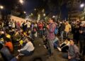 Demonstrators watch the CONCACAF Nations League group A football match between Trinidad and Tobago and Guatemala while blocking a road during a protest demanding the resignation of Attorney General Consuelo Porras and prosecutor Rafael Curruchiche in Guatemala City on October 13, 2023. – Guatemalan indigenous leaders announced Thursday that they will maintain road blockades to demand the resignation of the attorney general, whom they accuse of persecution against President-elect Bernardo Arévalo, after a meeting with President Alejandro Giammattei and OAS delegates failed. (Photo by Johan ORDONEZ / AFP)