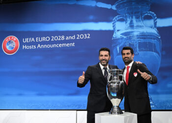 Head of Italian delegation and Italian former professional football player Gianluigi Buffon (L) and Turkish coach, former football player and head of the ambassador of the Turkish delegation Volkan Demirel (R) pose after Italy and Turkey were elected to host the Euro 2032 fooball tournament during the announcement ceremony at the UEFA headquarters in Nyon on October 10, 2023. (Photo by Fabrice COFFRINI / AFP)