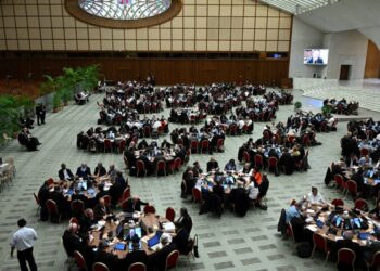 Delegates take part in the 16th Ordinary General Assembly of the Synod of Bishops, at Paul VI Audience Hall at the Vatican, on October 13, 2023. – The Holy Father opened a major congress on October 4, 2023 on the Catholic Church’s future vowing open doors to “everyone” despite tensions with conservatives on issues from LGBTQ faithful to the treatment of divorcees. (Photo by Filippo MONTEFORTE / AFP)