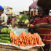 [FILES[ A roadside vendor sells carrots to a buyer in Lagos, Nigeria’s commercial capital, on March 14, 2022. – From Nigerian airlines to Malawi bakers, African countries are feeling the pain of Ukraine’s crisis as supply disruptions hike inflation and oil prices push up fuel costs.Global oil prices touched ten-year highs of more than $100 a barrel soon after Russia invaded Ukraine, doubling diesel prices for African countries like Nigeria.Ukraine and Russia are both major suppliers of wheat and grains to Africa and Western sanctions and disruptions are already hiking costs across the continent. (Photo by PIUS UTOMI EKPEI / AFP)