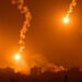 This picture taken from a position near Sderot along the Israeli border with the Gaza Strip on November 5, 2023, shows flares dropped by Israeli forces above the Palestinian enclave amid ongoing battles between Israel and the Palestinian Hamas movement. (Photo by Aris MESSINIS / AFP)