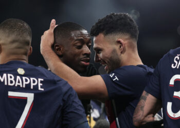 Paris Saint-Germain's Portuguese forward #09 Goncalo Ramos (CR) congratulates Paris Saint-Germain's French forward #10 Ousmane Dembele (C) after he scored PSG's third goal during the French L1 football match between Paris Saint-Germain (PSG) and AS Monaco at The Parc des Princes Stadium in Paris on November 24, 2023. (Photo by FRANCK FIFE / AFP)